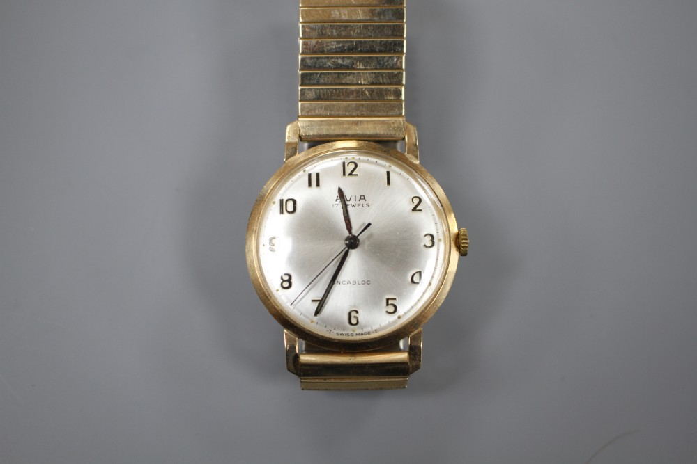 A gentlemans 1960s 9ct gold Avia manual wind wrist watch, on a gold plated strap, with Avia box.
